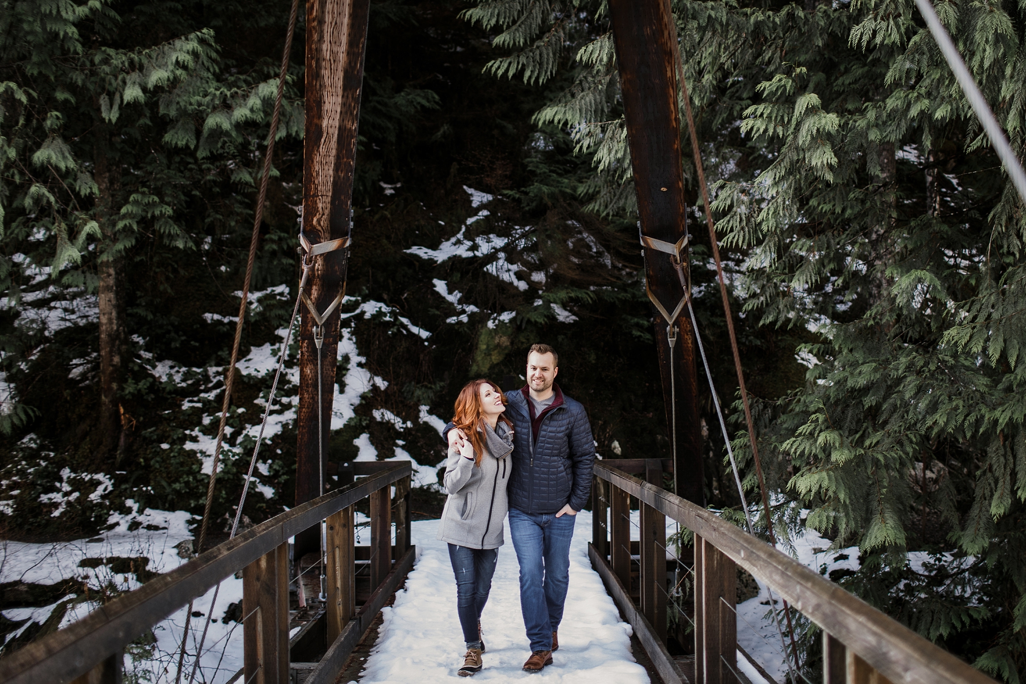 Couple walking over the Middle Fork Snoqualmie River Bridge | Megan Montalvo Photography
