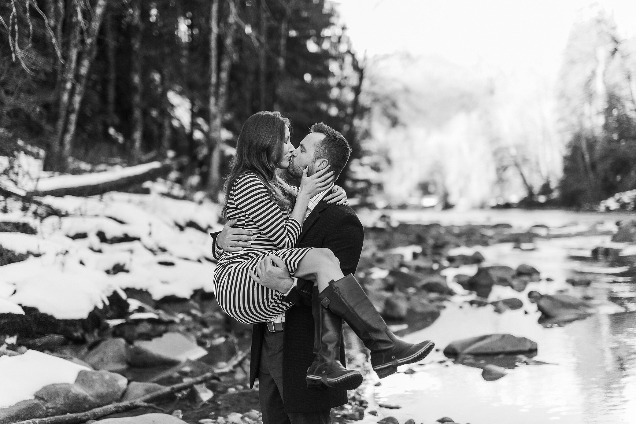 Man sweeping his fiance off her feet during their Snoqualmie engagement session | Megan Montalvo Photography
