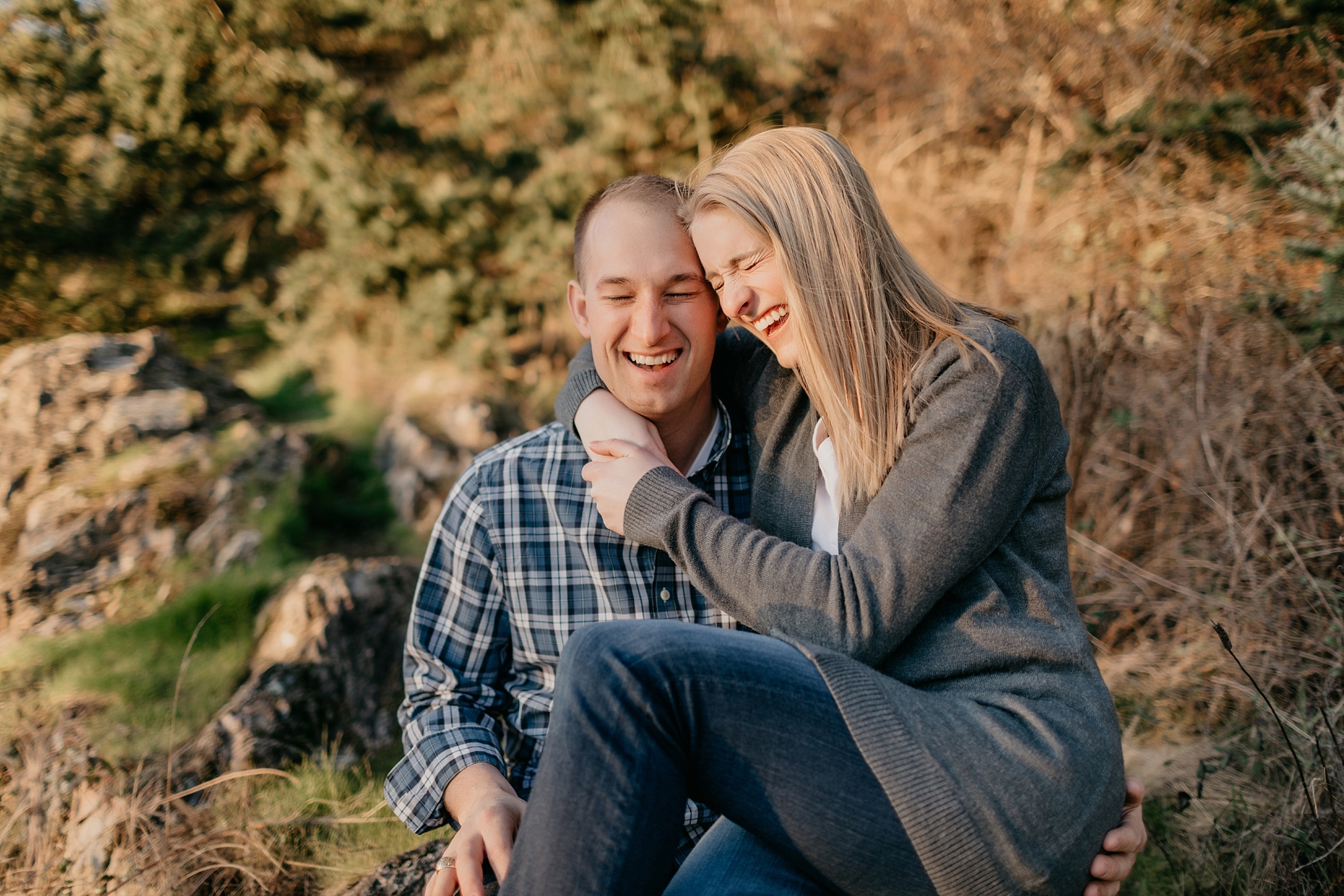 Couple laughing during engagement session at Deception Pass | Megan Montalvo Photography