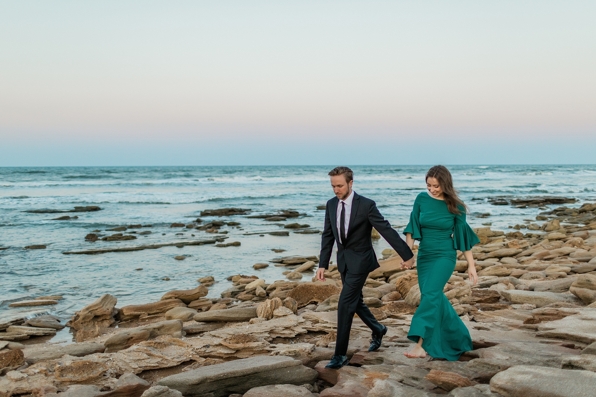Bride and Groom-to-be walking on St. Augustine Beach | Megan Montalvo Photography 