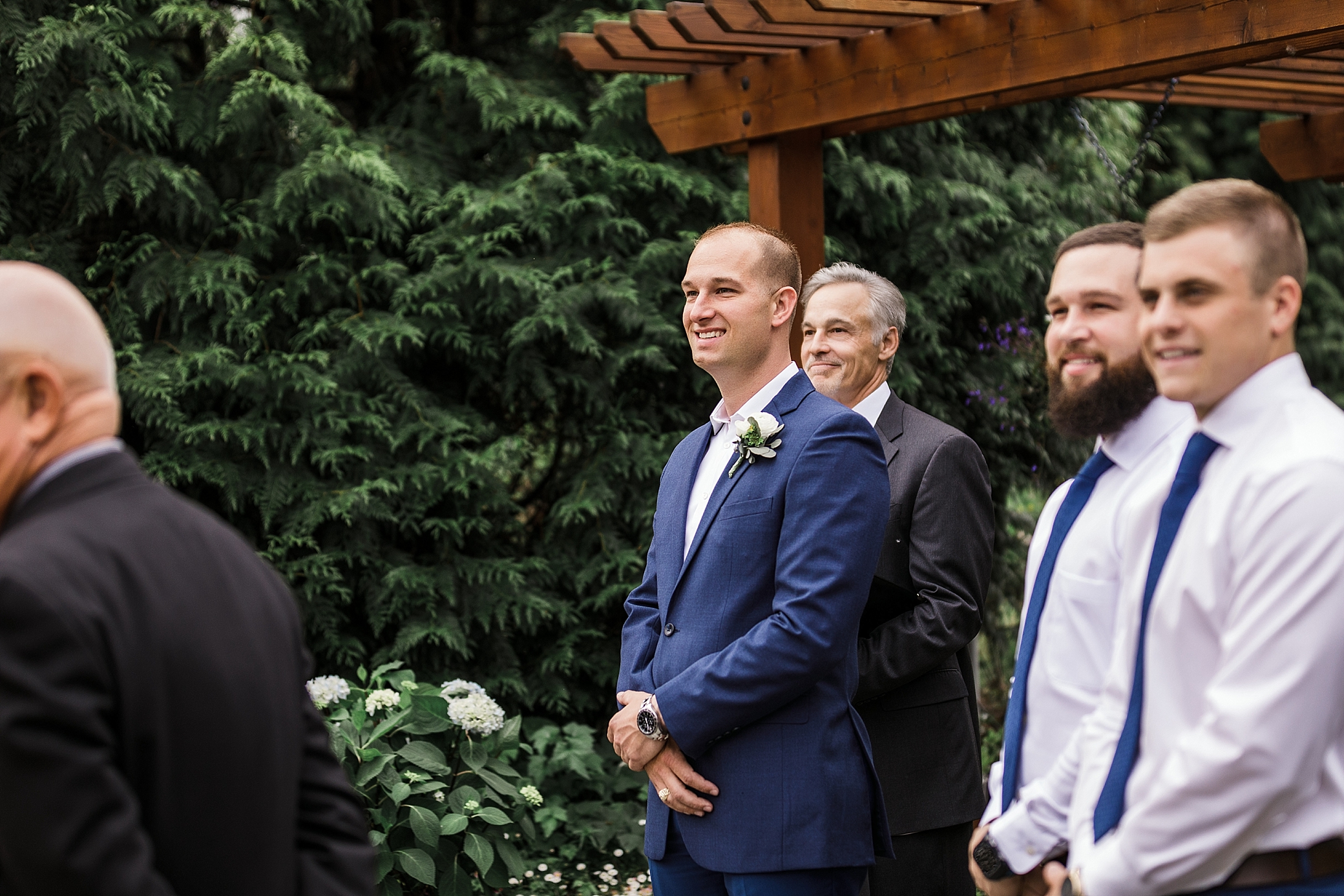 Groom anticipating bride walking down the aisle at Seattle Wedding Venue, Willow Lodge | Megan Montalvo Photography 
