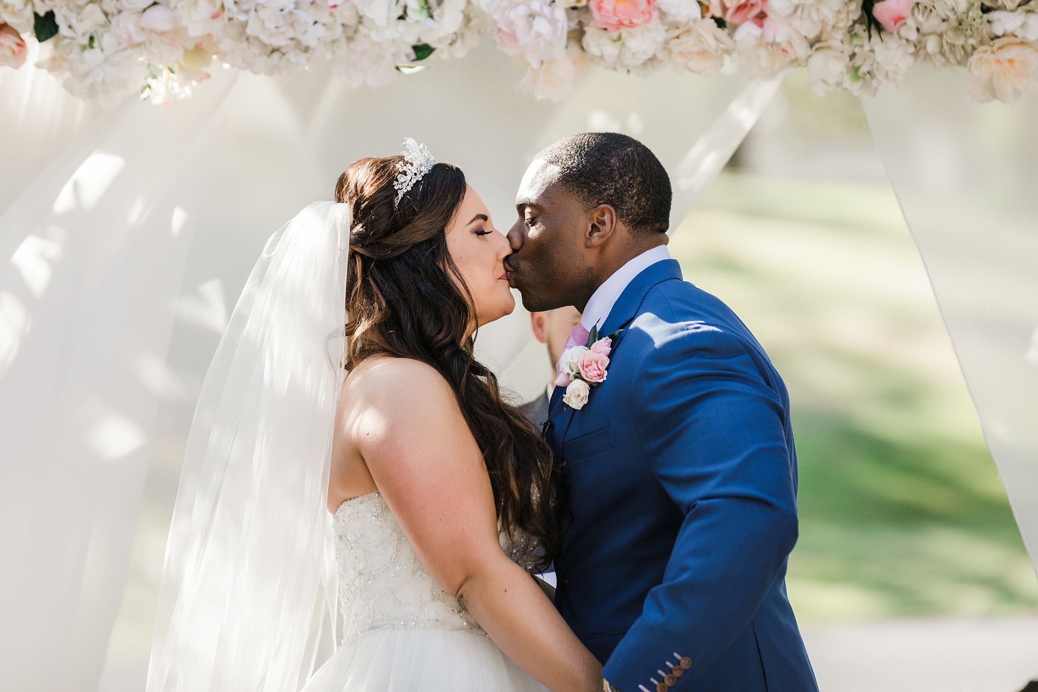 Bride and groom first kiss photographed by Olympia Wedding Photographer, Megan Montalvo Photography