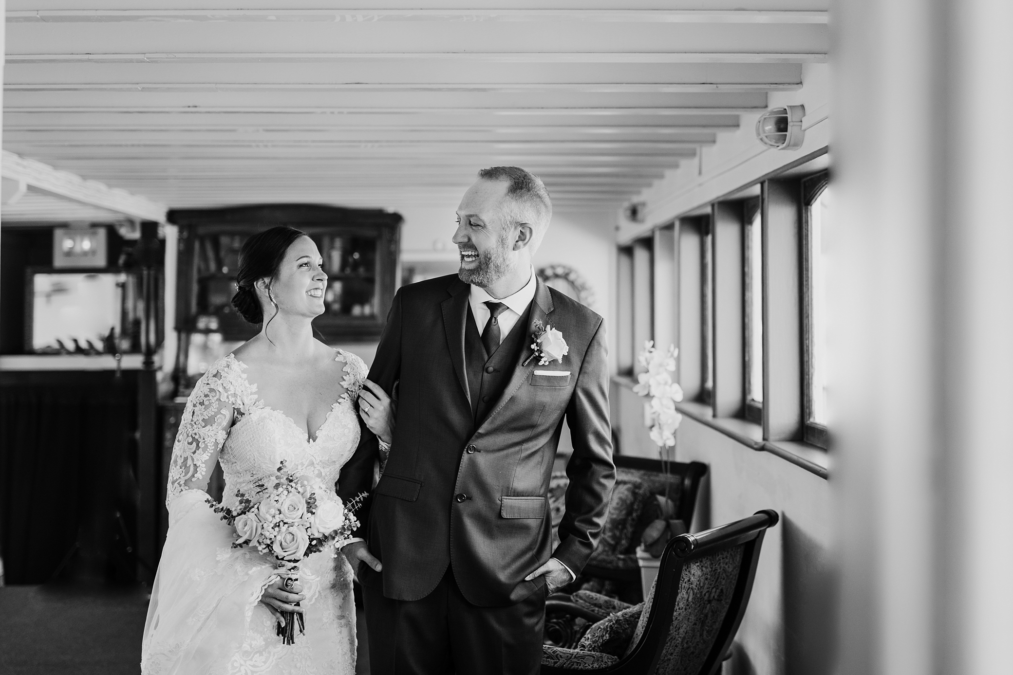Bride and groom share a moment together before the start of their waterfront wedding ceremony on the MV Skansonia in Seattle. Photographed by Washington Wedding Photographer, Megan Montalvo Photography. 