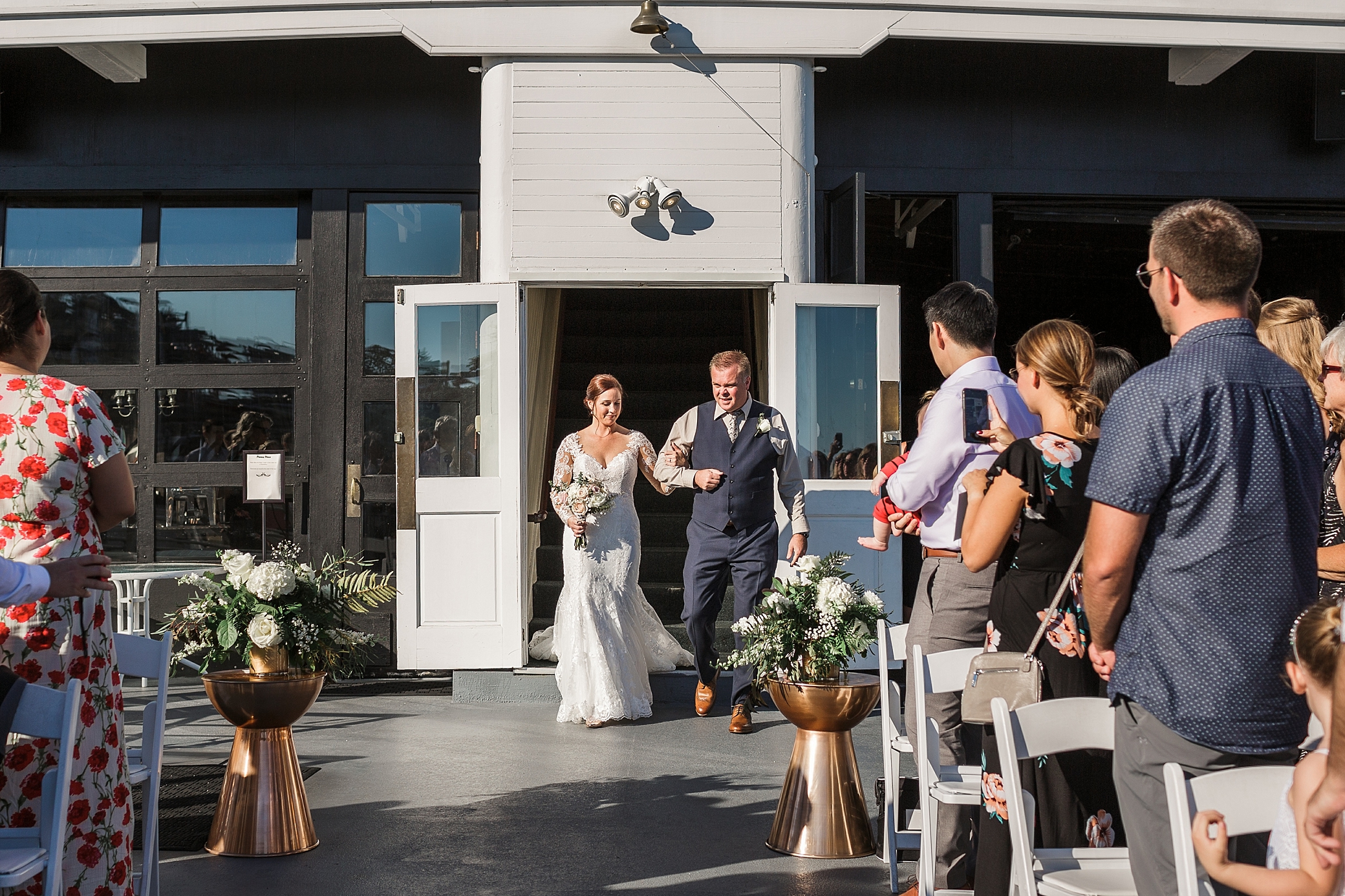 Bride walking down the aisle | Seattle waterfront wedding venue -MV Skansonia | Megan Montalvo Photography 