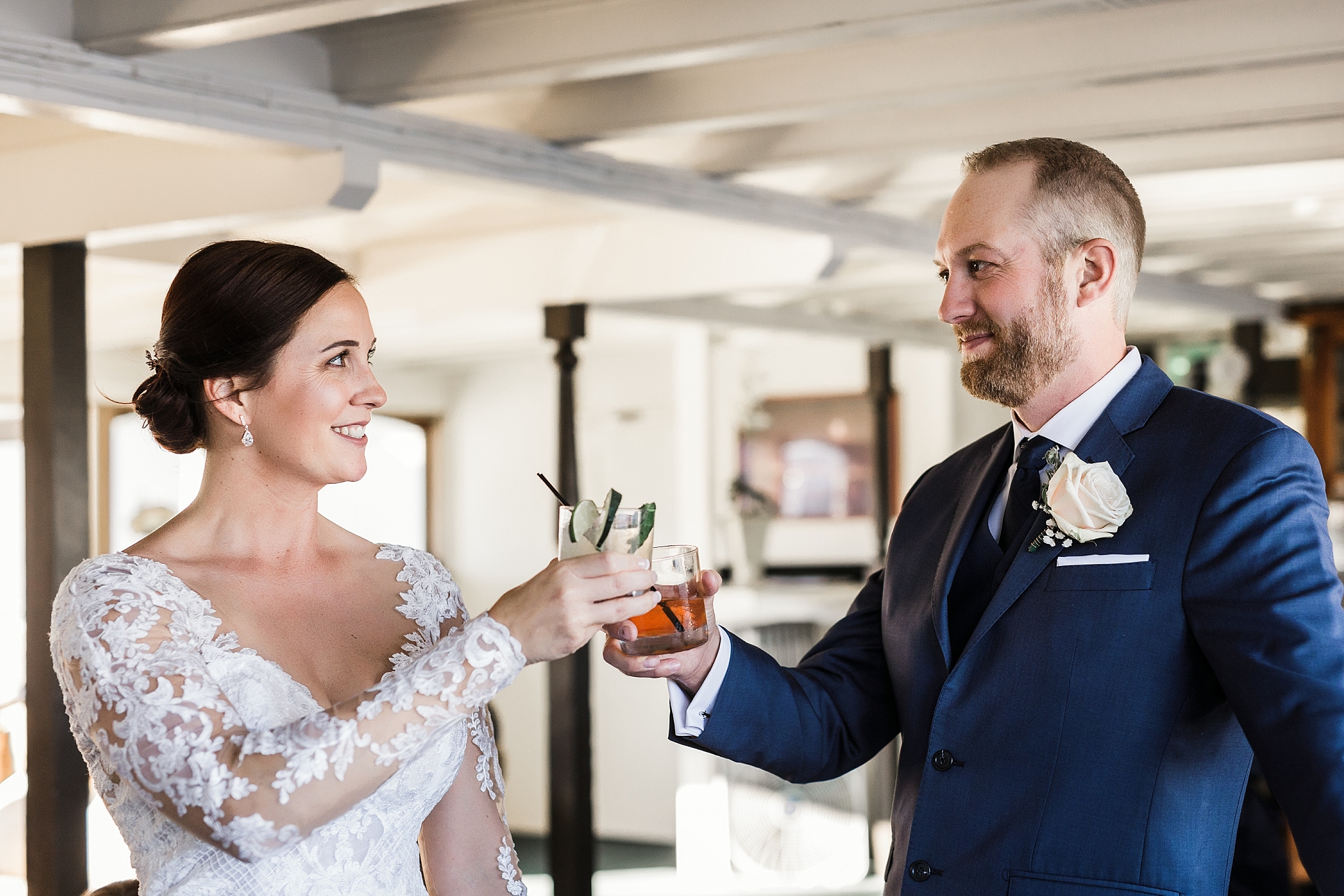 Bride and groom share a cocktail on the MV Skansonia | Megan Montalvo Photography 