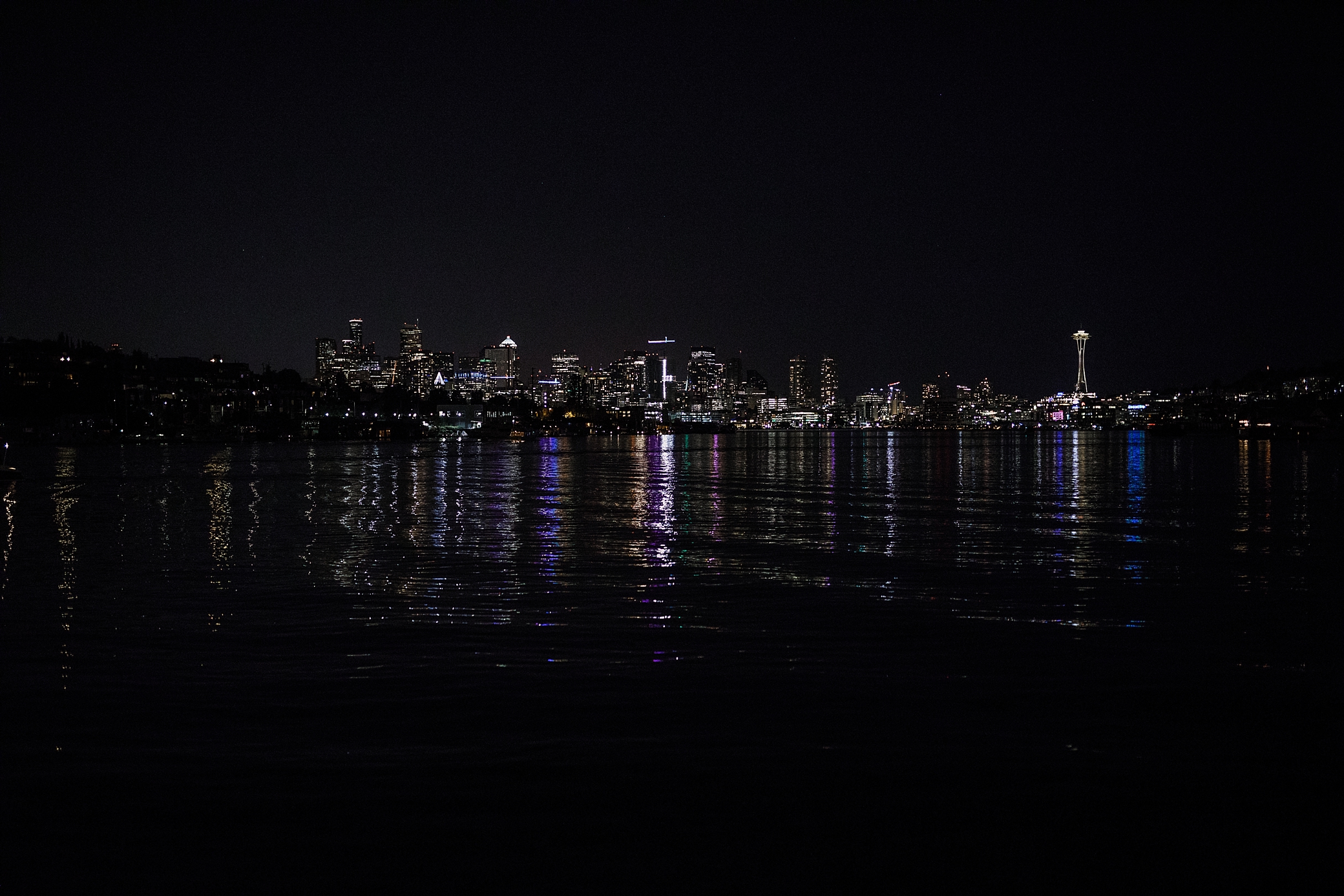 Seattle skyline from the Mv Skansonia after a beautiful wedding ceremony photographed by Seattle Wedding Photographer, Megan Montalvo Photography 