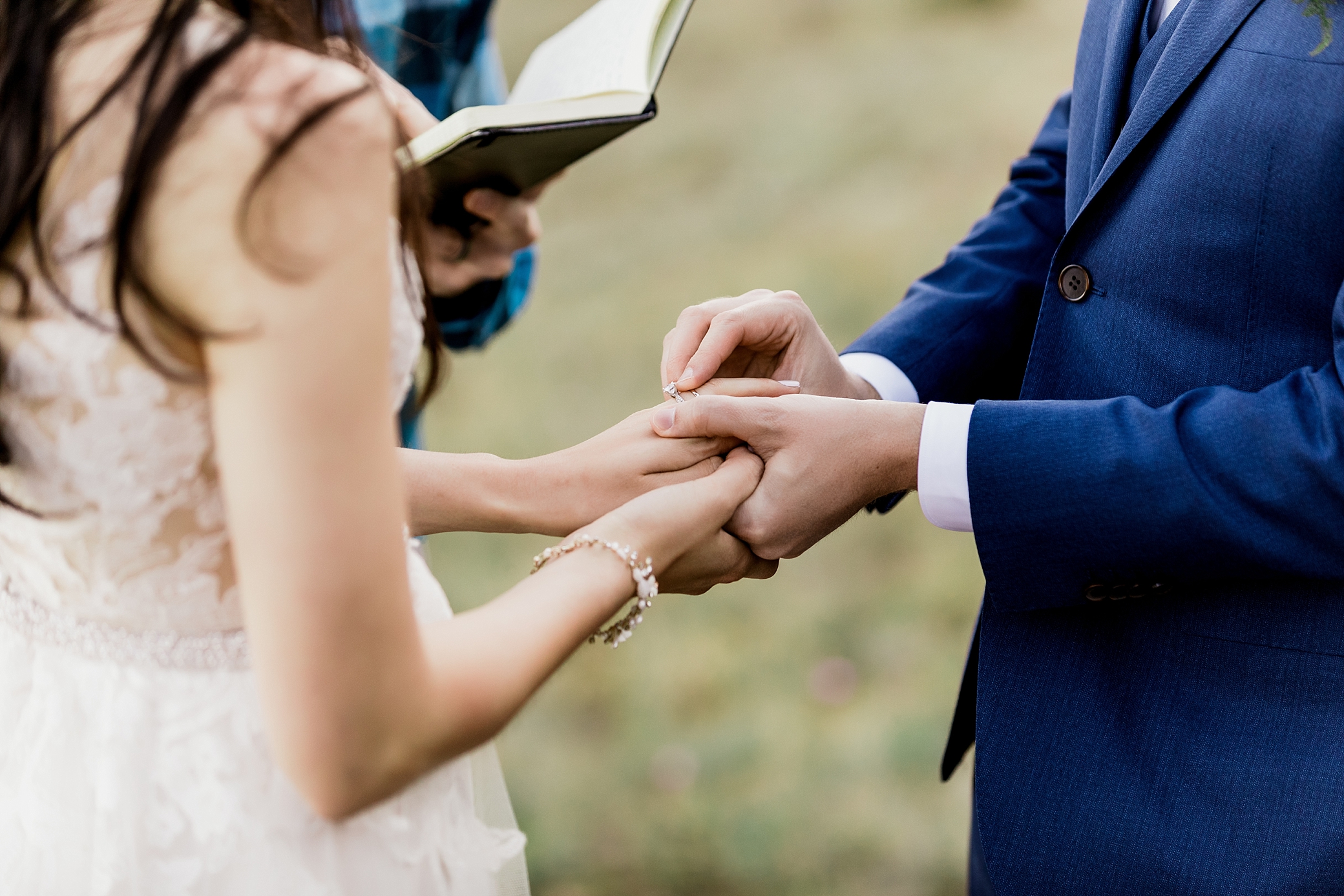 Bride and groom exchange rings during Hurricane Ridge Elopement | Megan Montalvo Photography