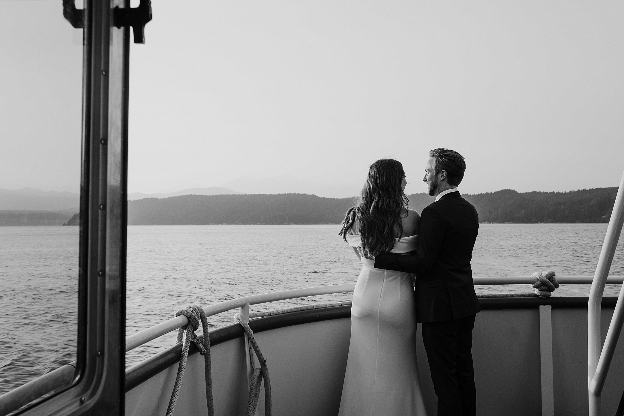 Bride and groom on the Lady Alderbrook at Alderbrook Resort and Spa | Photographed by PNW Wedding Photographer, Megan Montalvo Photography. 