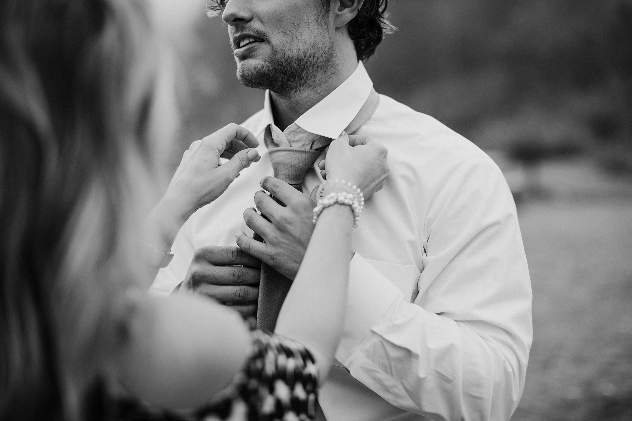 Groom getting ready for elopement at Gold Creek Pond | Megan Montalvo Photography