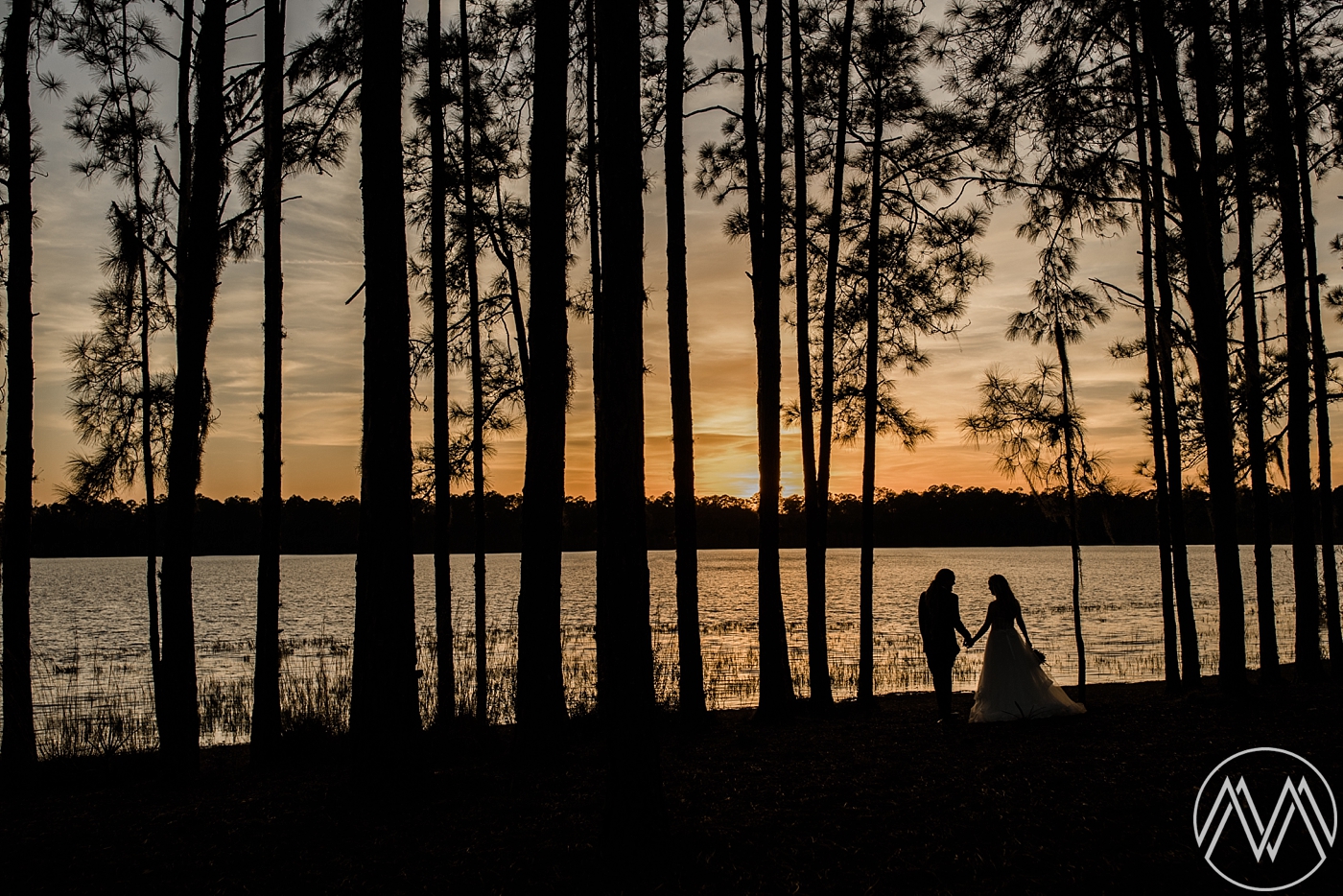 Sunset bride and groom portraits at Doe Lake Campground in the Ocala National Forest. Photographed by Destination Wedding Photographer, Megan Montalvo Photography. 