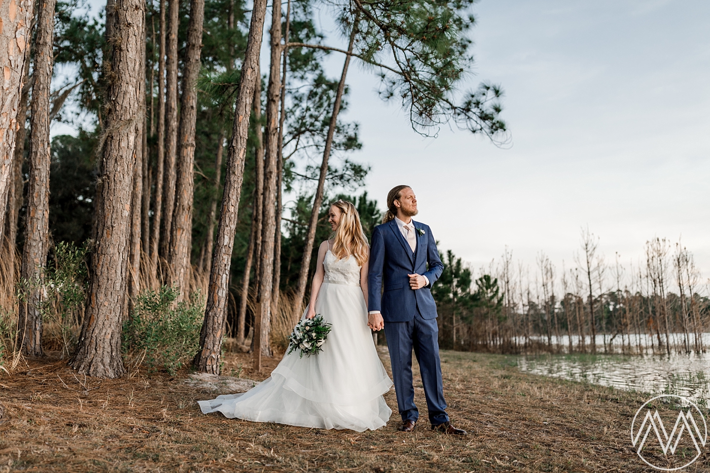 Sunset bride and groom portraits at Doe Lake Campground in the Ocala National Forest. Photographed by Destination Wedding Photographer, Megan Montalvo Photography. 