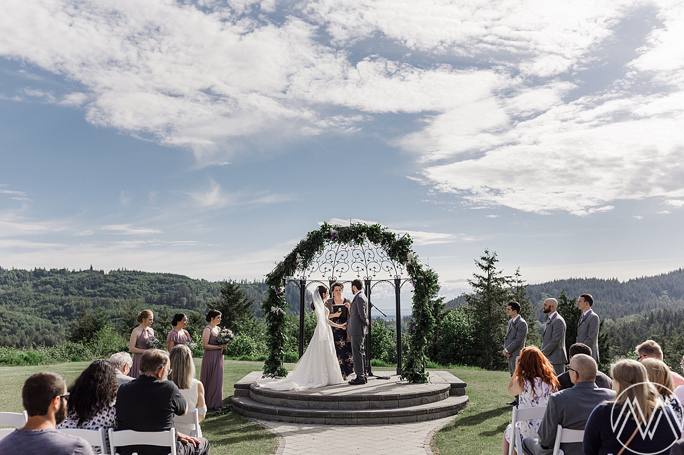 Intimate wedding ceremony at Eaglemont Golf Course overlooking the Olympic Mountains. Photographed by Mount Vernon Wedding Photographer, Megan Montalvo Photography. 
