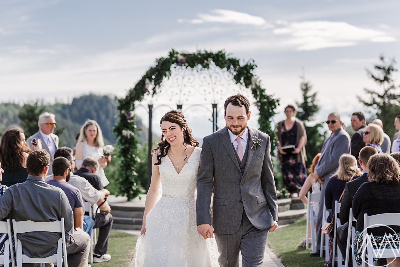 Intimate wedding ceremony at Eaglemont Golf Course overlooking the Olympic Mountains. Photographed by Mount Vernon Wedding Photographer, Megan Montalvo Photography. 