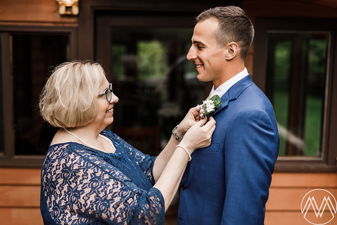 Groom + Mother getting ready before intimate elopement ceremony at Mt. Rainier. Photographed by Megan Montalvo Photography. 