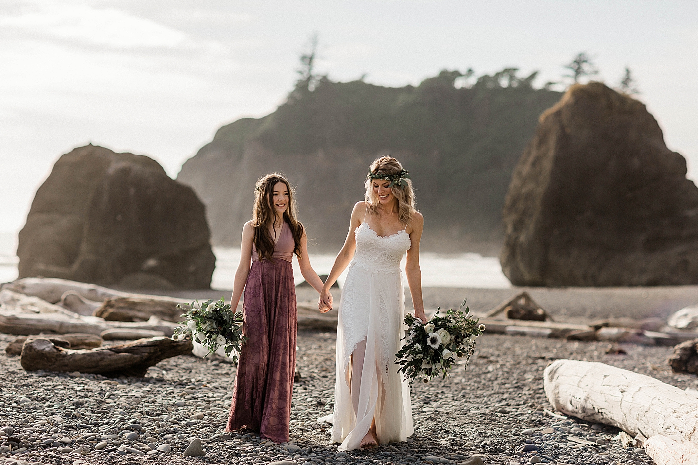 Mama and daughter walking together along Ruby Beach before elopement ceremony. Photographed by Megan Montalvo Photography. 