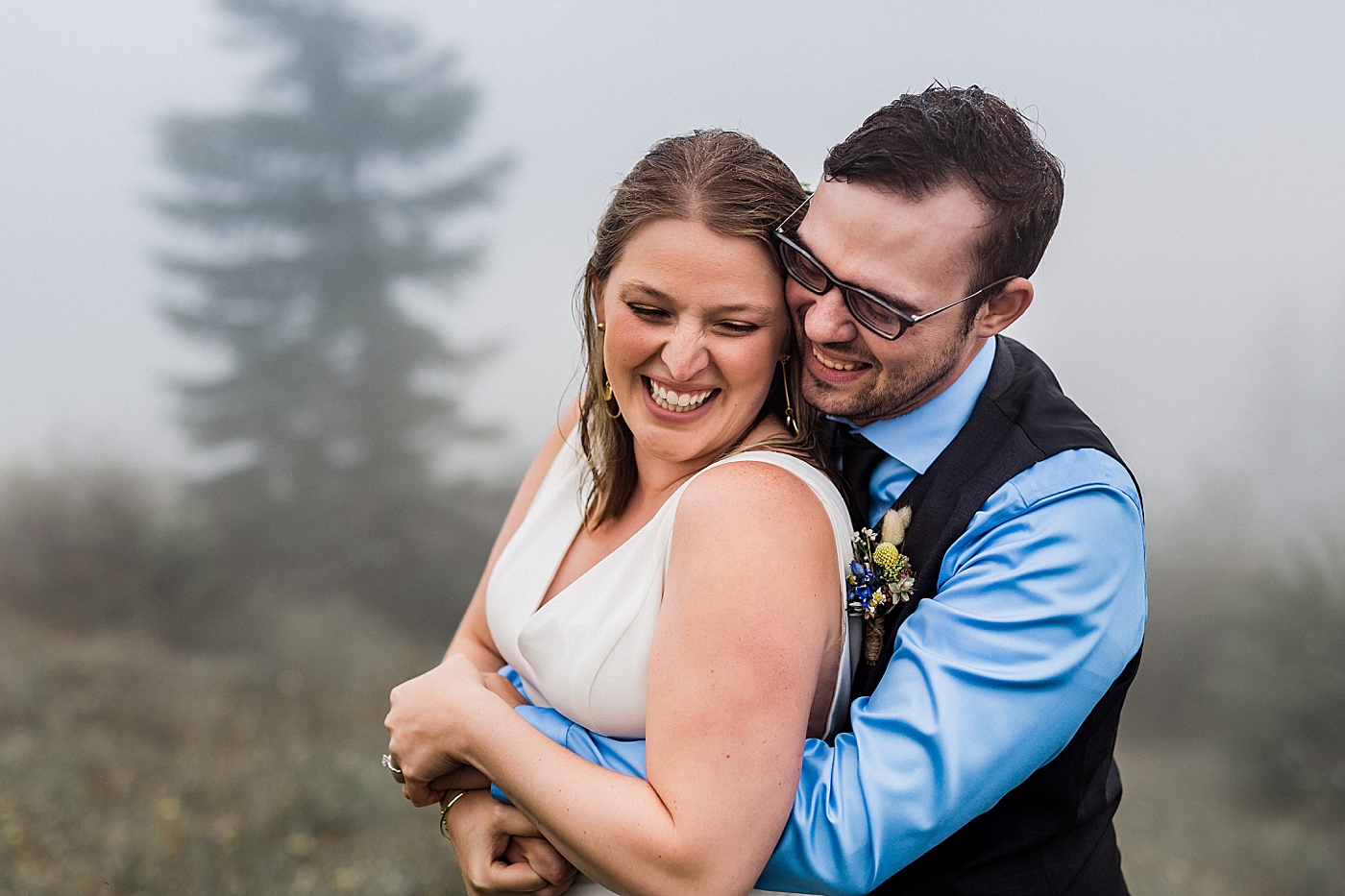 Bride and groom adventure through Mount St. Helens in the rain after elopement ceremony. Photographed by PNW Elopement Photographer, Megan Montalvo Photography. 