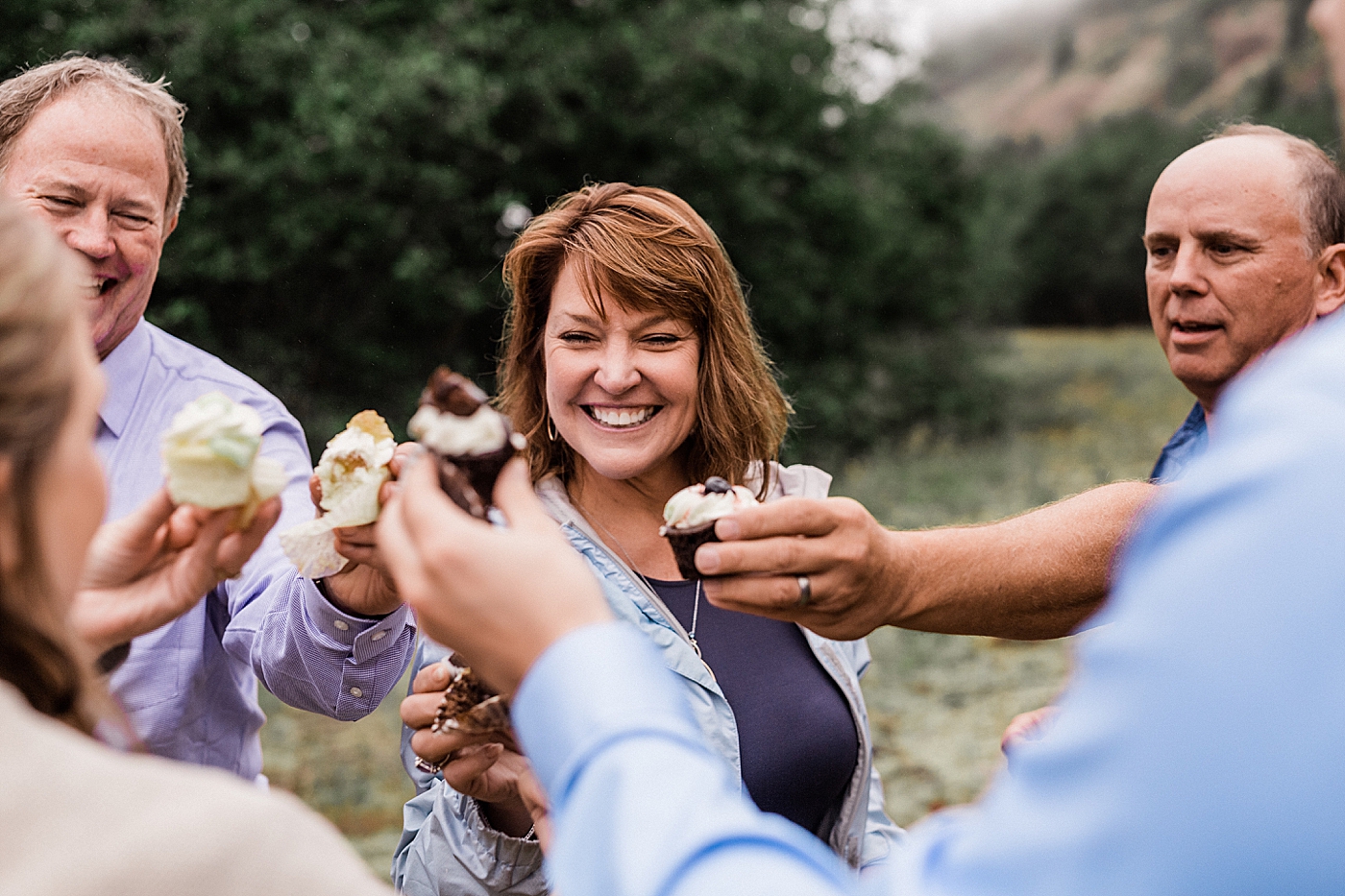 Couple celebrates with cupcakes and champagne at Mount St. Helens Elopement. Photographed by Adventure Elopement Photographer, Megan Montalvo Photography. 