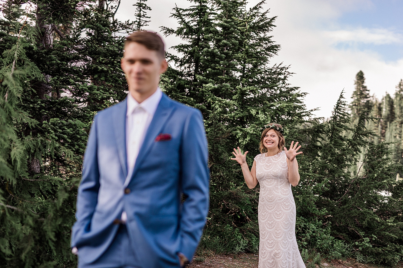 Couples first look at Mount Rainier before elopement ceremony. Photographed by Megan Montalvo Photography. 