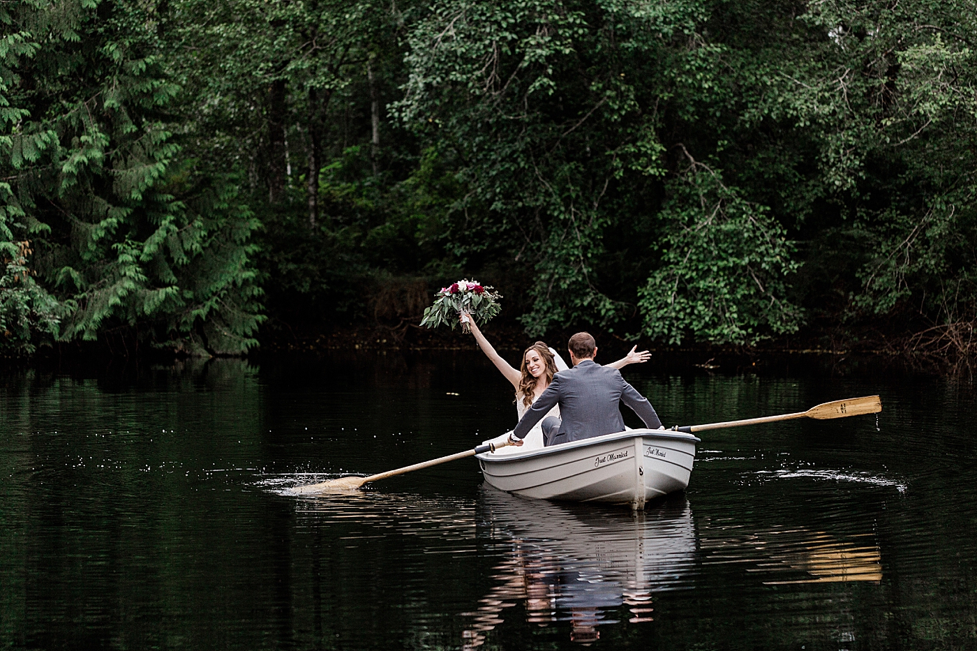 Bride and groom photos in the row boat at Cedar Springs. Photography by Port Orchard Wedding Photographer, Megan Montalvo Photography. 