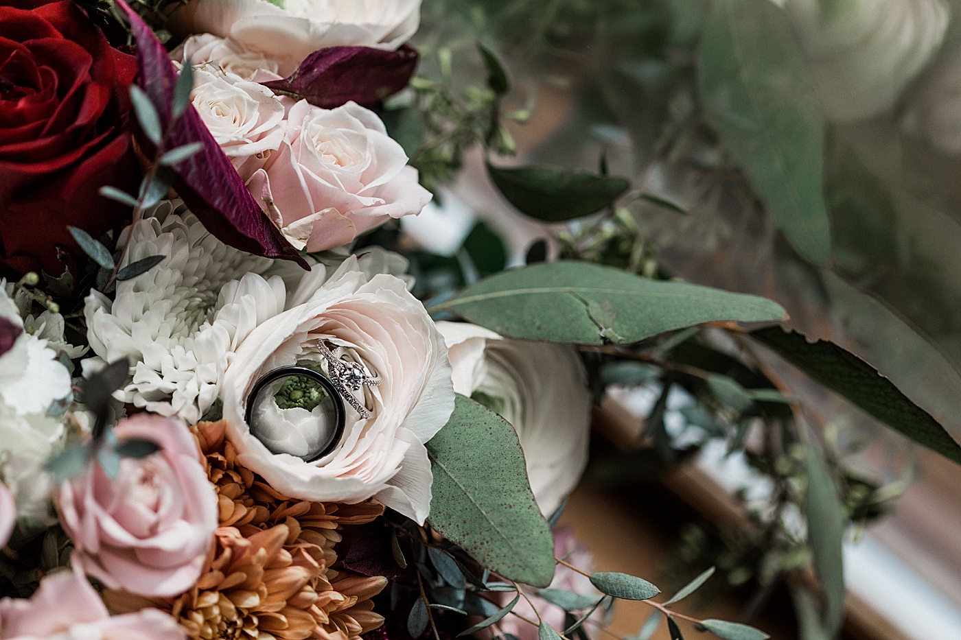 Wedding rings in bridal bouquet. Photo by Megan Montalvo Photography.