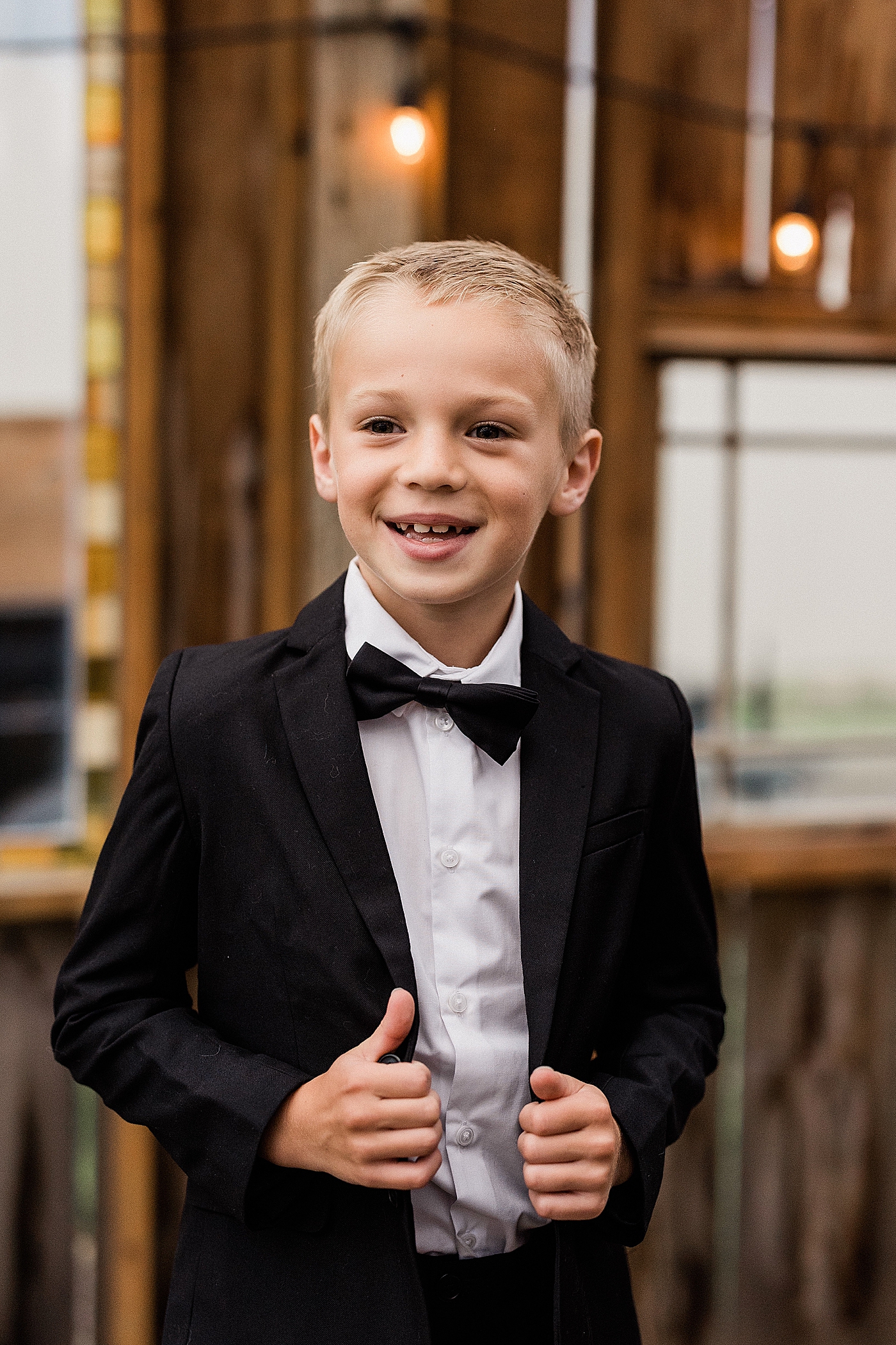 Young boy in suit for wedding. Photo by Megan Montalvo Photography.