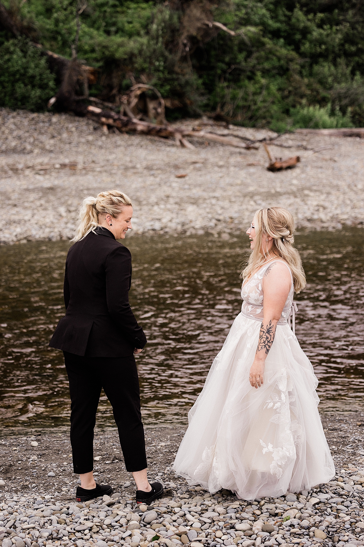 First look between brides at elopement at Ruby Beach. Photo by Megan Montalvo Photography.