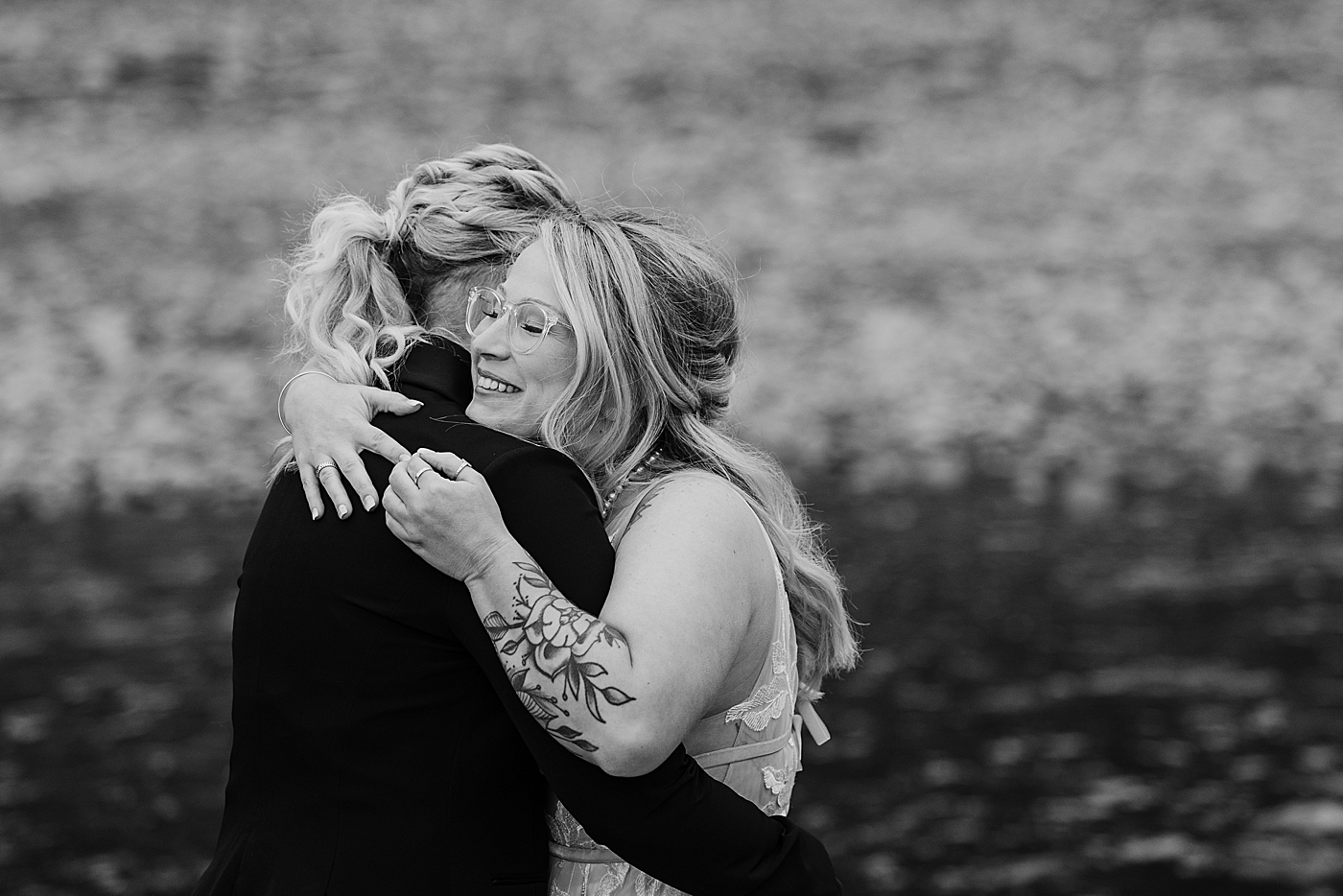Bride's hugging each other during first look. Photo by Megan Montalvo Photography.