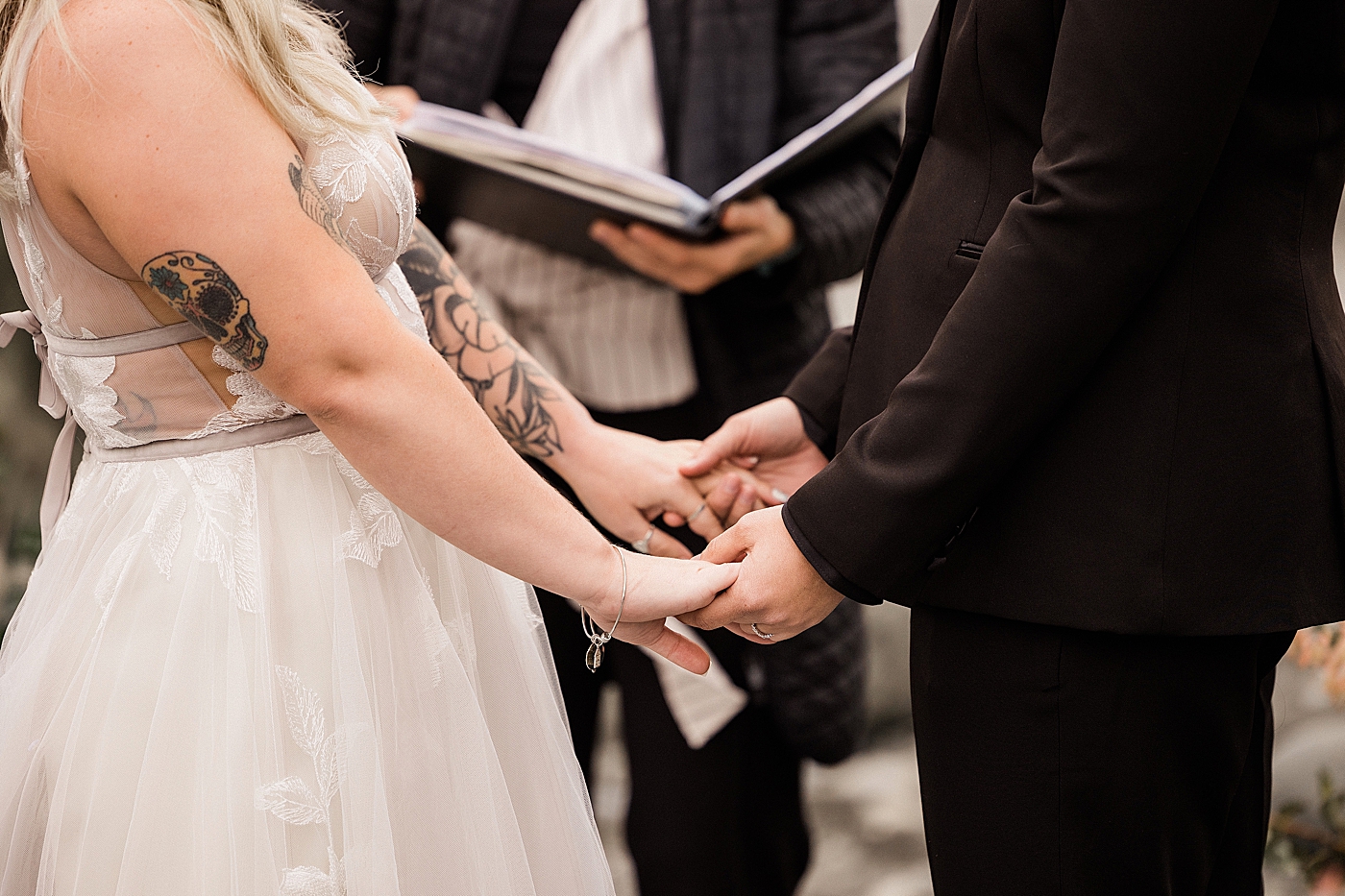 Brides holding hands | Photo by Megan Montalvo Photography