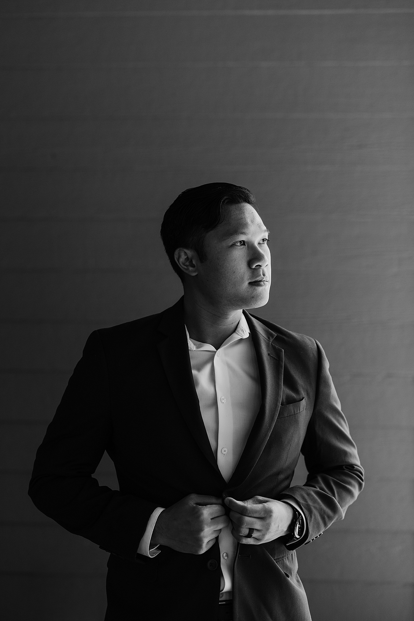 Black and white portrait of the groom. Photo by Megan Montalvo Photography.