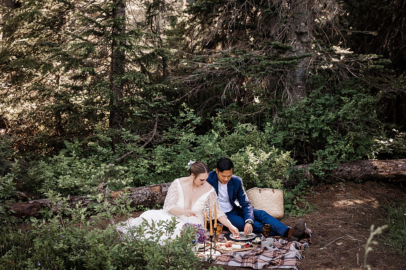 Picnic in the forest at Mt. Rainier during elopement. Photo by Megan Montalvo Photography.