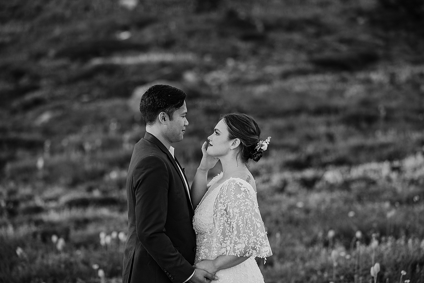 Sweet moment between the bride and groom during intimate elopement. Photo by Megan Montalvo Photography.