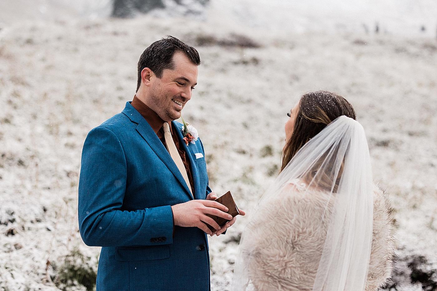 Bride and groom exchange vows in the snow at Paradise Point in Mount Rainier | Megan Montalvo Photography