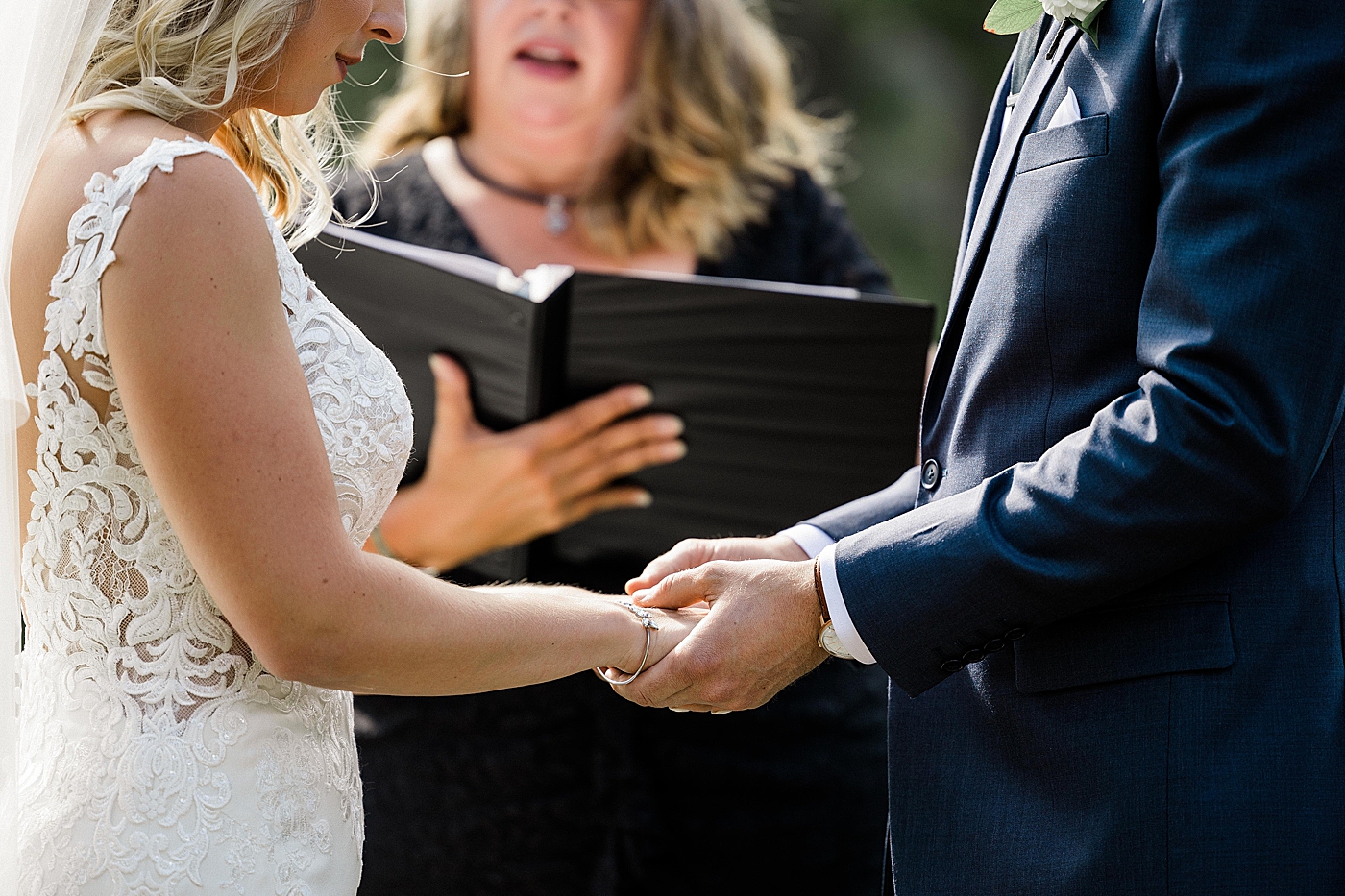 Bride and groom exchange vows during intimate elopement ceremony. Photo by Megan Montalvo Photography.