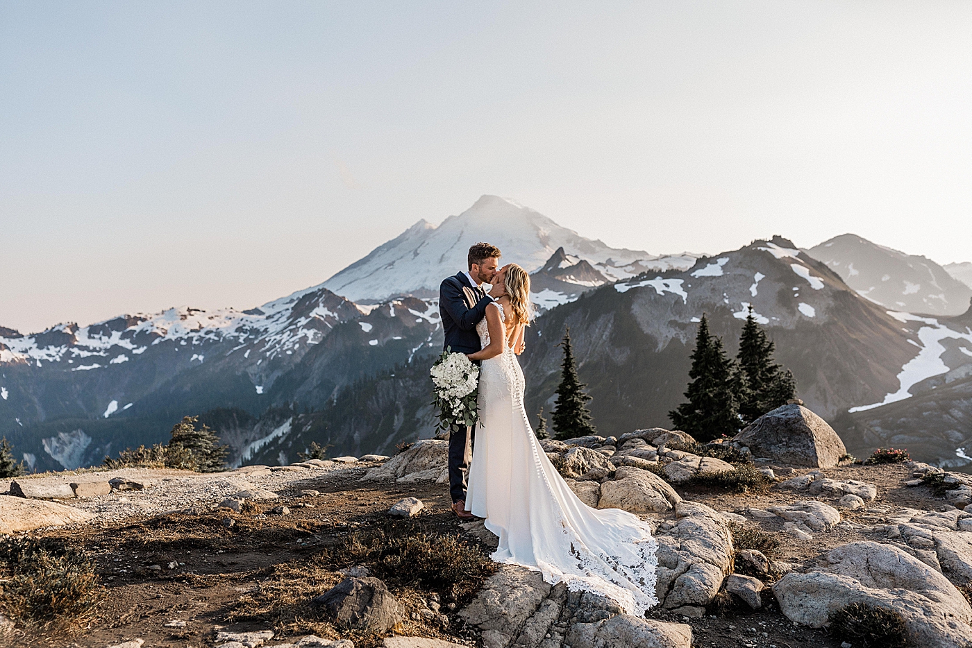 Couple kissing in front of Mount Baker on Artist Point