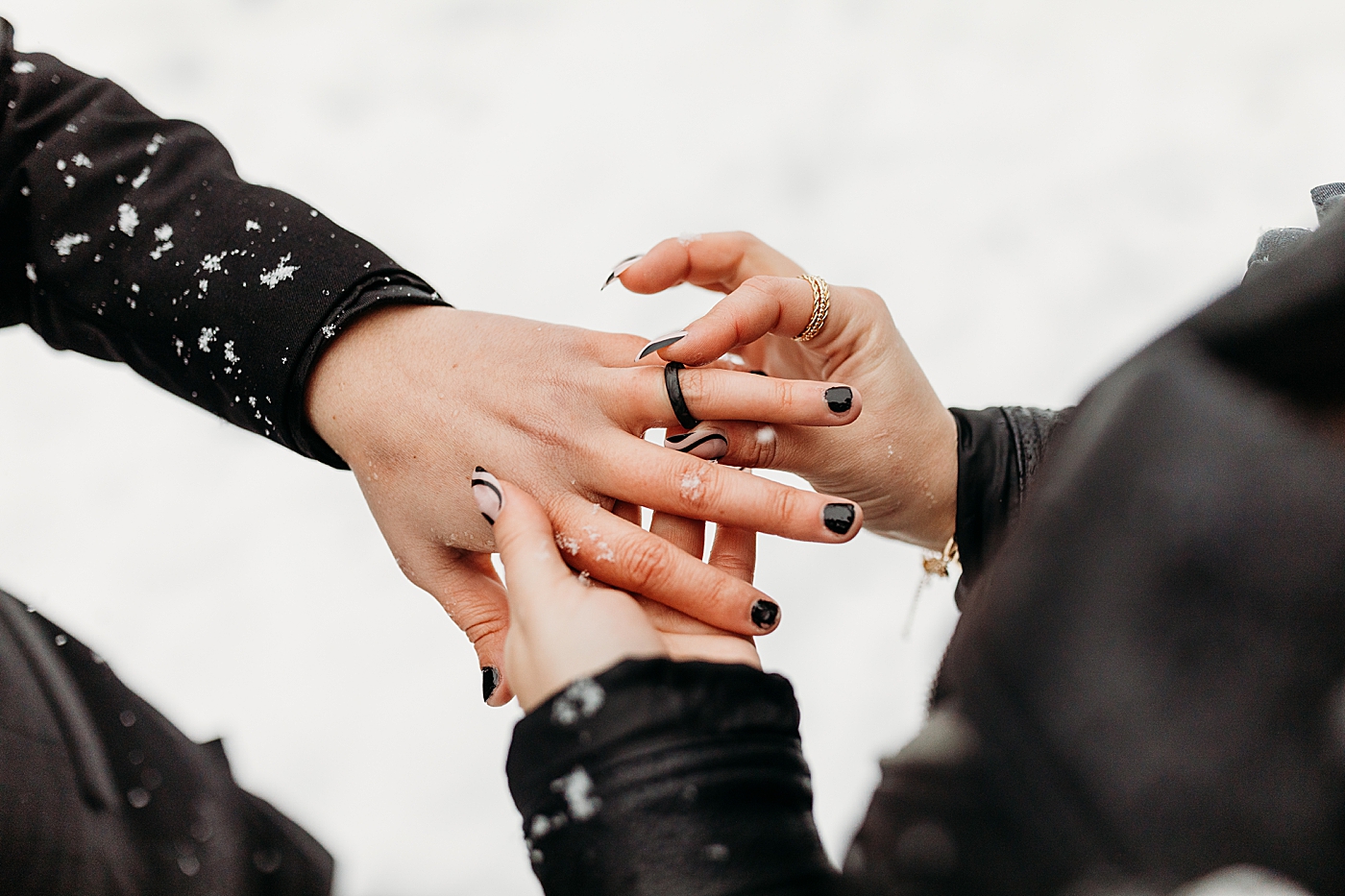 Ring exchange during winter elopement. Photo by Megan Montalvo Photography.