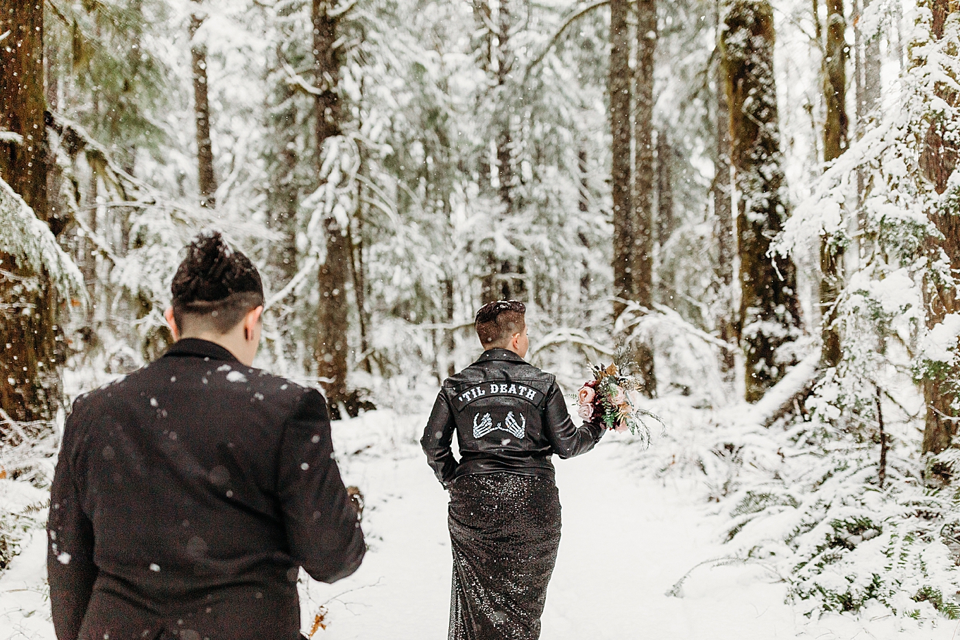 Couple walking through the snow. Photo by Megan Montalvo Photography.