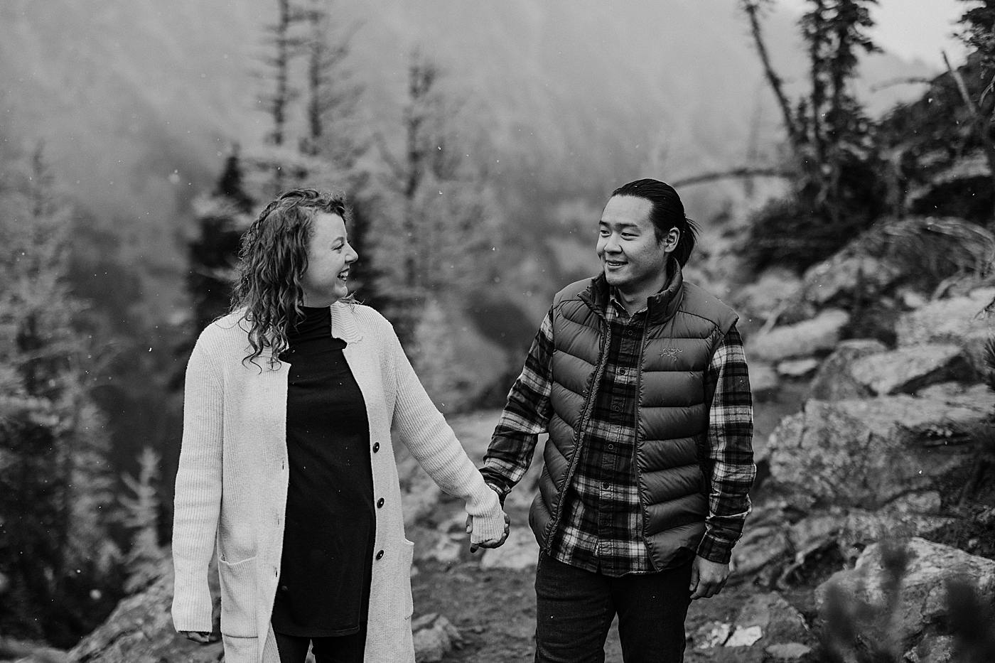 Engagement photo of couple walking and holding hands. Photo by Megan Montalvo Photography.