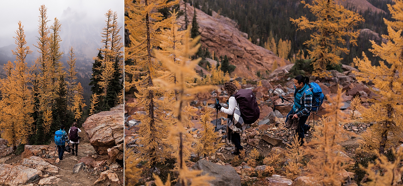 Couple hiking through the golden larches during the fall at Lake Ingalls in Central, WA. Photo by Megan Montalvo Photography.