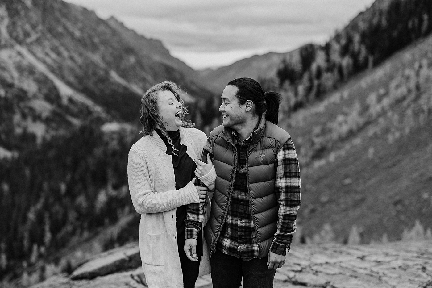 Couple laughing during engagement session. Photo by Megan Montalvo Photography.