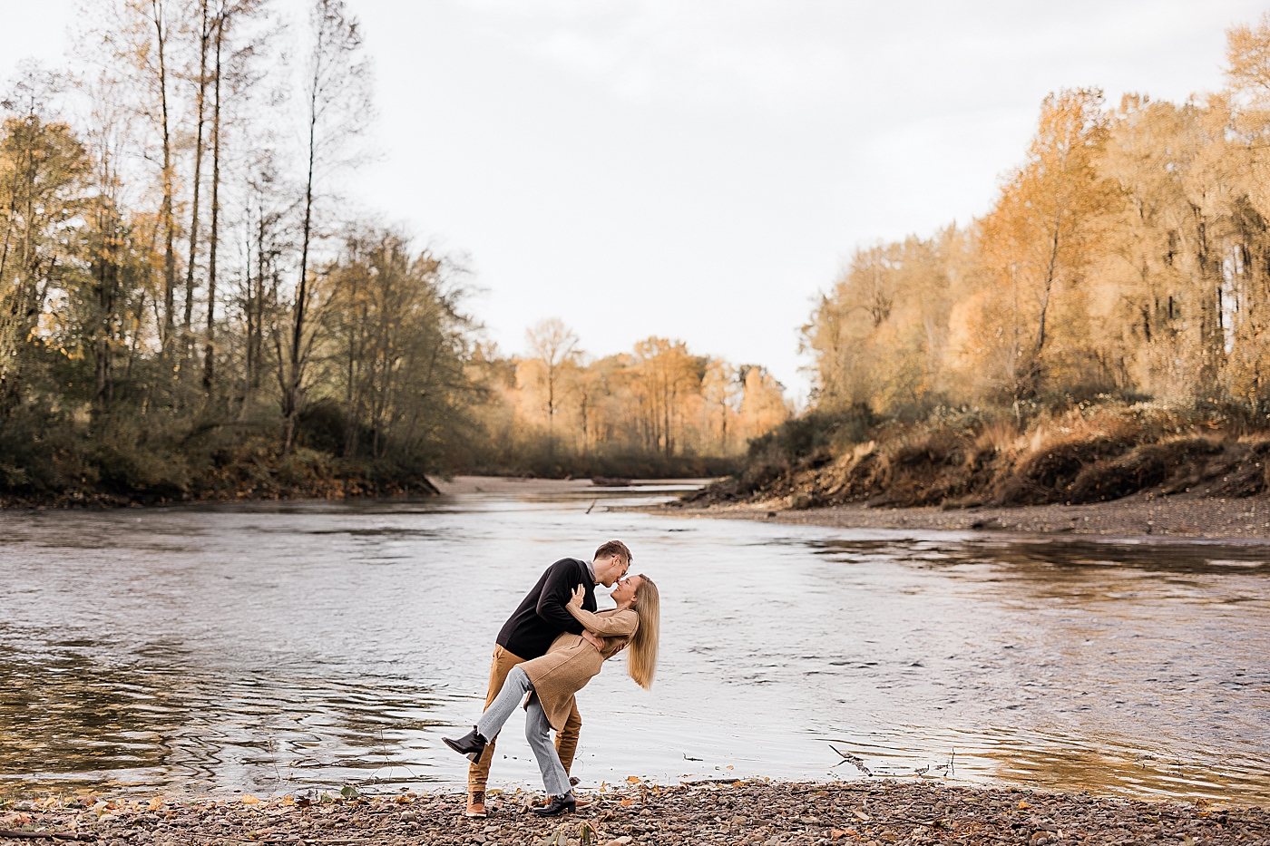 Couple dancing in front of the water along Snoqualmie River. Photo by Megan Montalvo Photography.