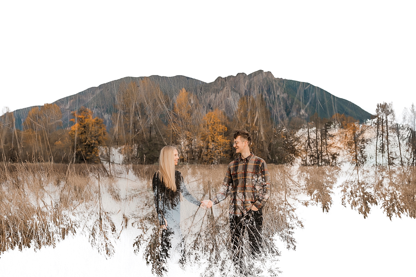 Double exposure photo of couple in field in front of Mount Si. Photo by Megan Montalvo Photography.