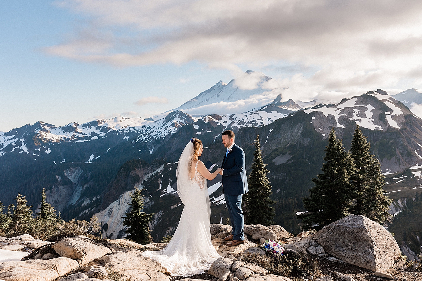 Couple exchanging vows at Artist Point. Photo by Megan Montalvo Photography.