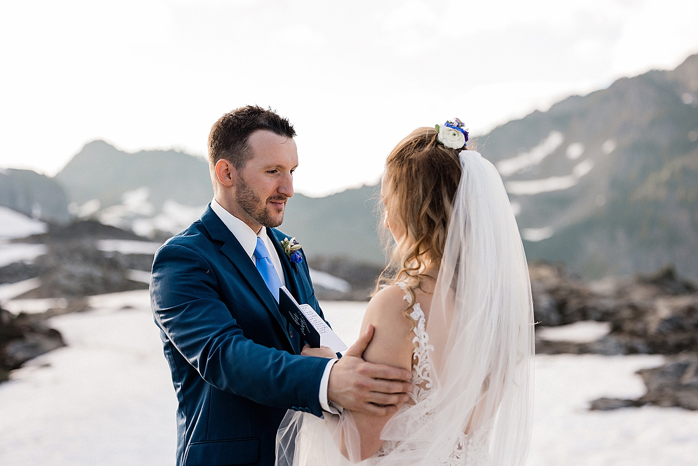 Summer elopement with snow in the background at Artist Point. Photo by Megan Montalvo Photography.