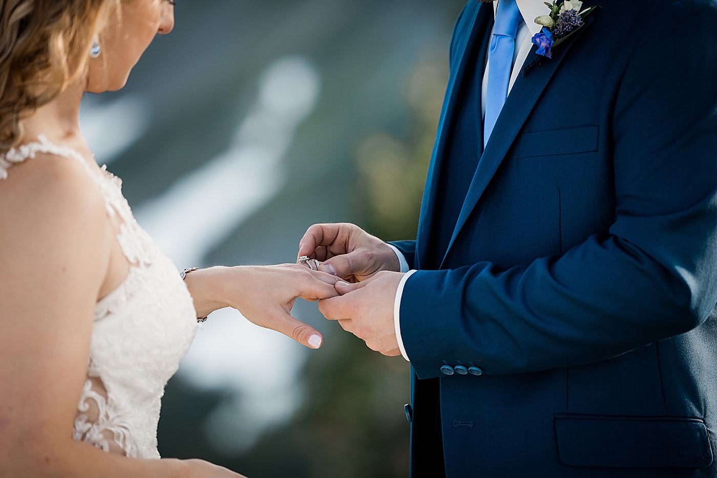 Ring exchange during elopement at Artist Point. Photo by Megan Montalvo Photography.