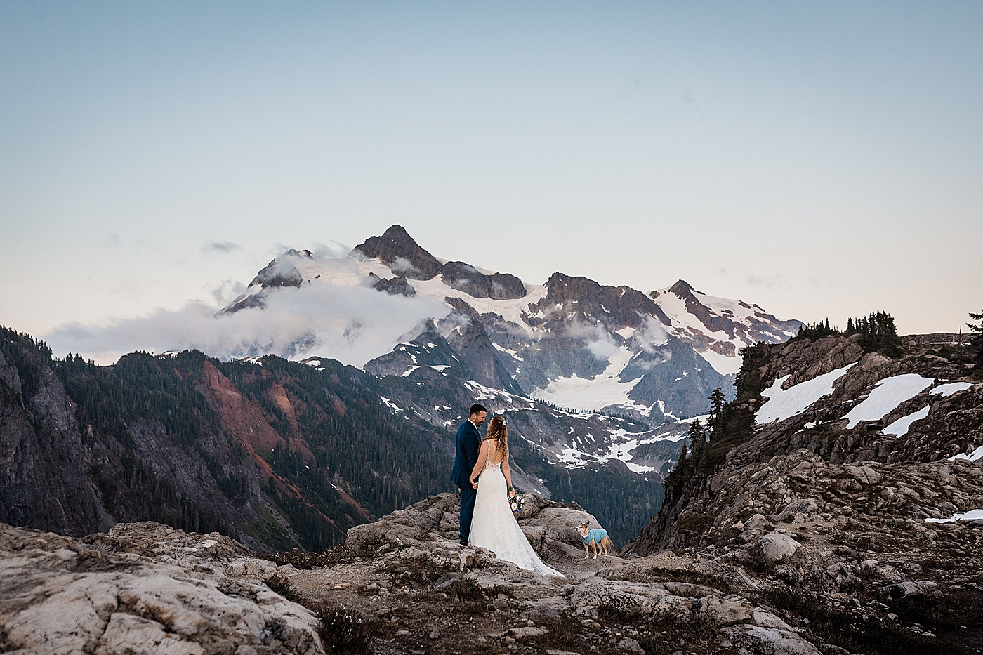 Couples portraits with stunning mountain views behind them. Photo by Megan Montalvo Photography.