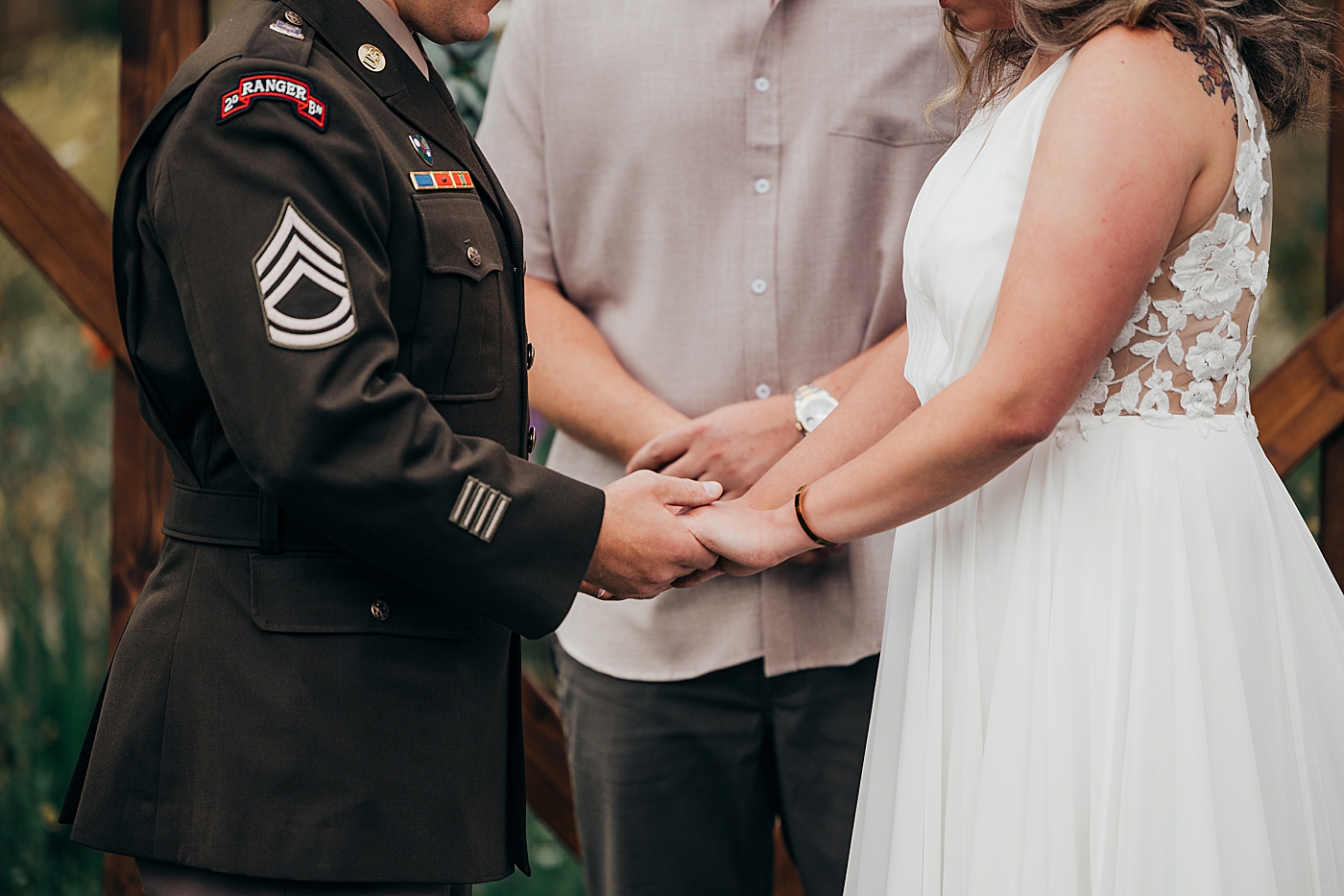 Couple holding hands during elopement ceremony. Photo by Megan Montalvo Photography.