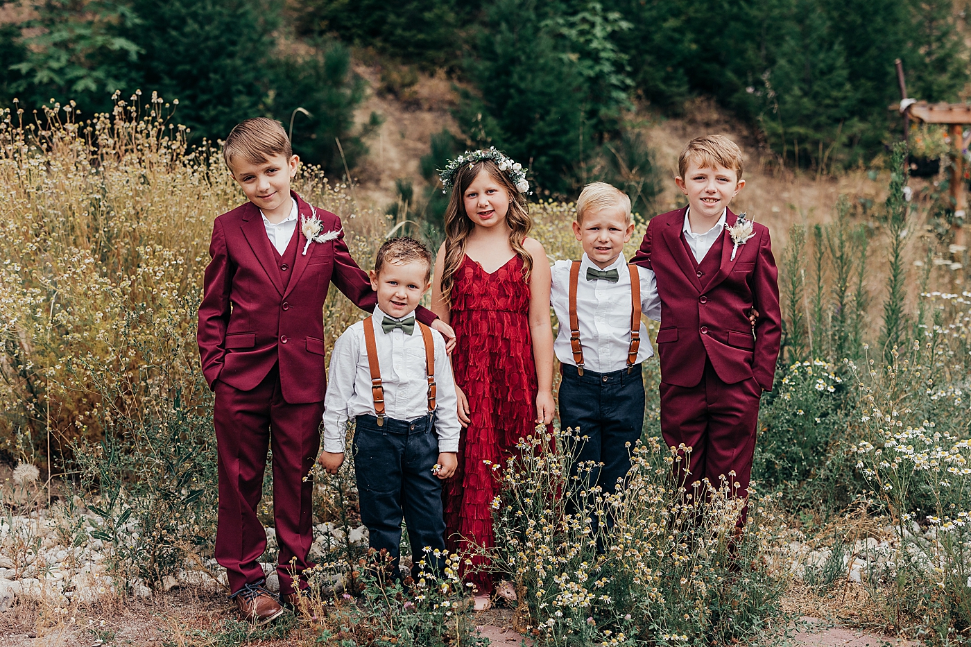 Cousins standing together at elopement ceremony in Leavenworth. Photo by Megan Montalvo Photography.