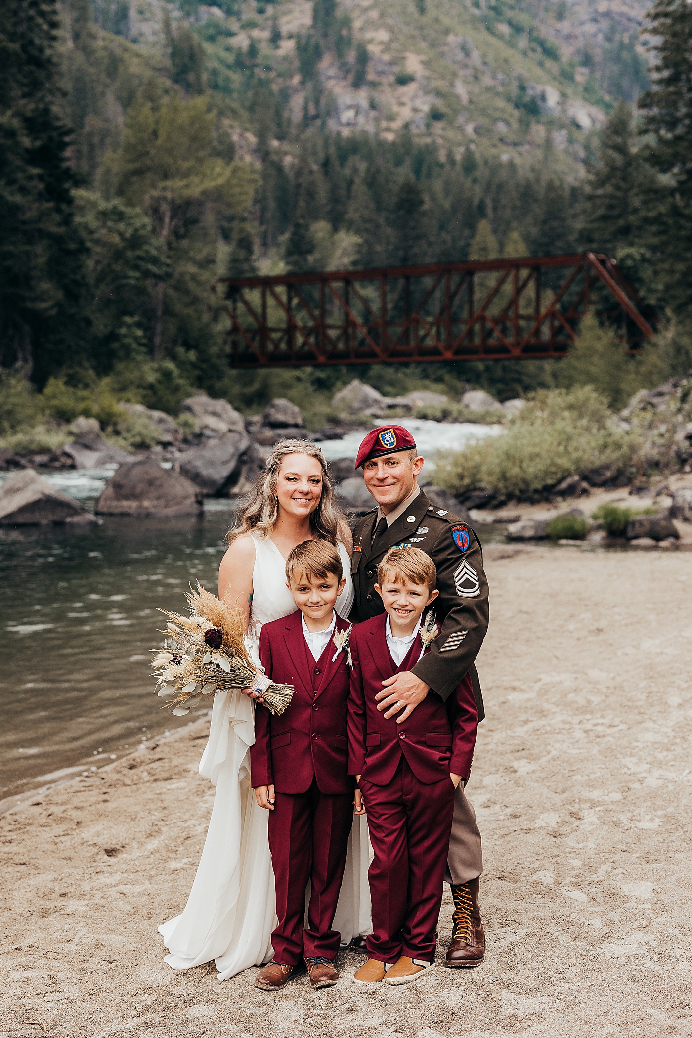 Newly married couple with their two boys. Photo by Megan Montalvo Photography.