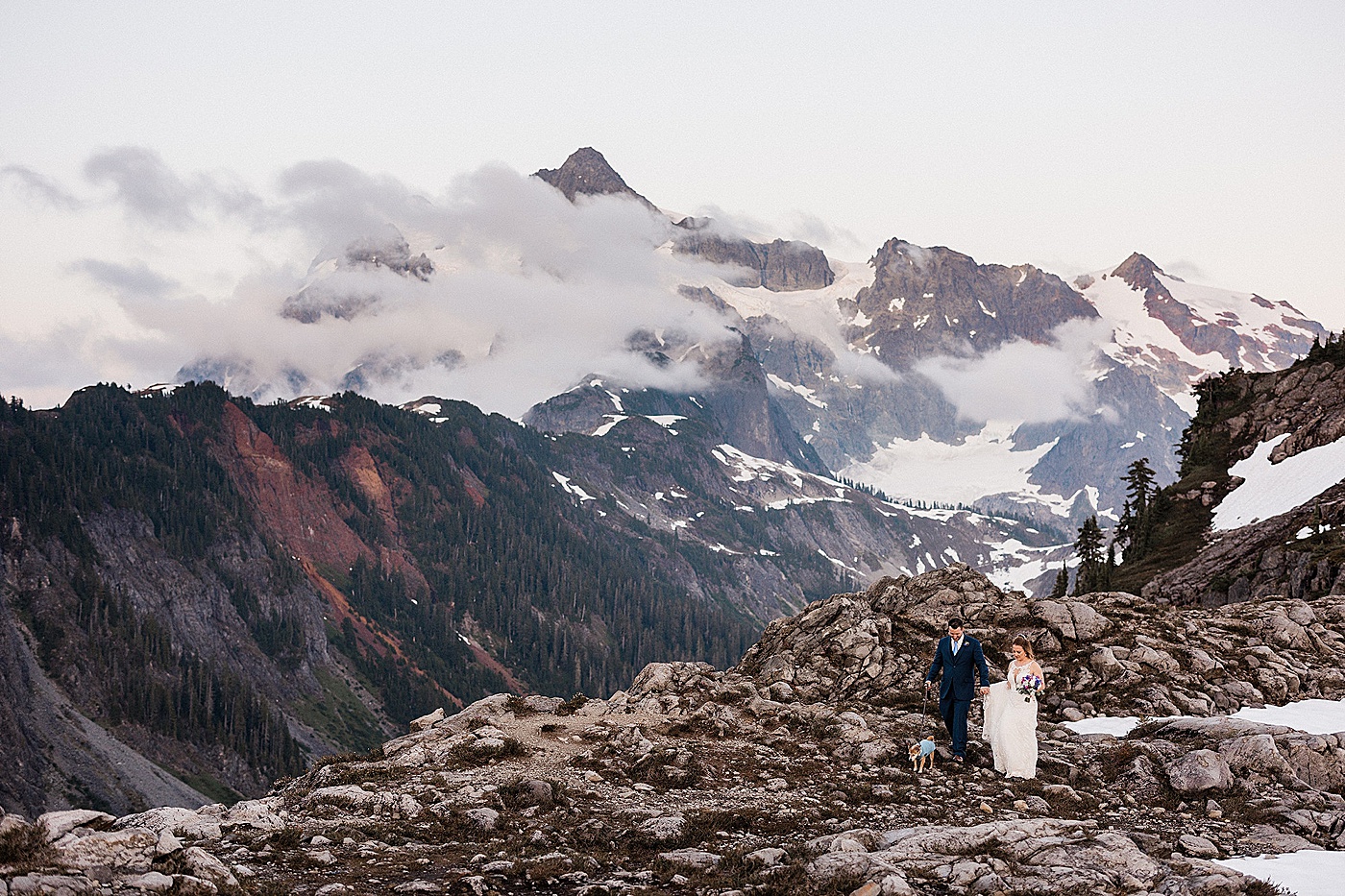 Bride and groom walking dog during elopement at Artist Point | Megan Montalvo Photography