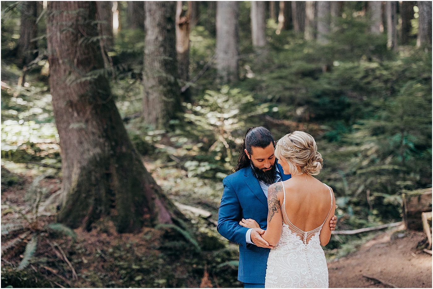 Bride and groom portraits in forest of Mount Rainier | Photo by Megan Montalvo Photography